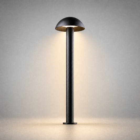 textured black matte outdoor bollard light with warm glow