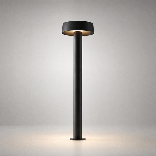 Matte black minimalist architectural ground light with flat disc shade and IP65 weatherproof rating