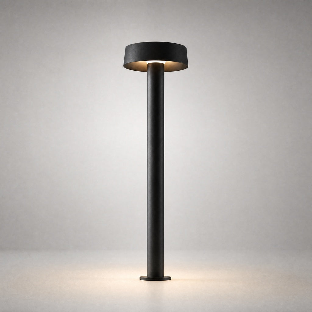 Black textured cylindrical outdoor lamp with warm LED base illumination