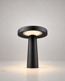 Black conical base LED outdoor floor lamp front view showing geometric silhouette