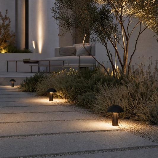 matte black mushroom path lights highlighting drought-tolerant shrubs