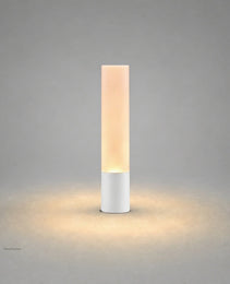 Matte white cylindrical exterior stake lamp with smooth finish and warm white LED output