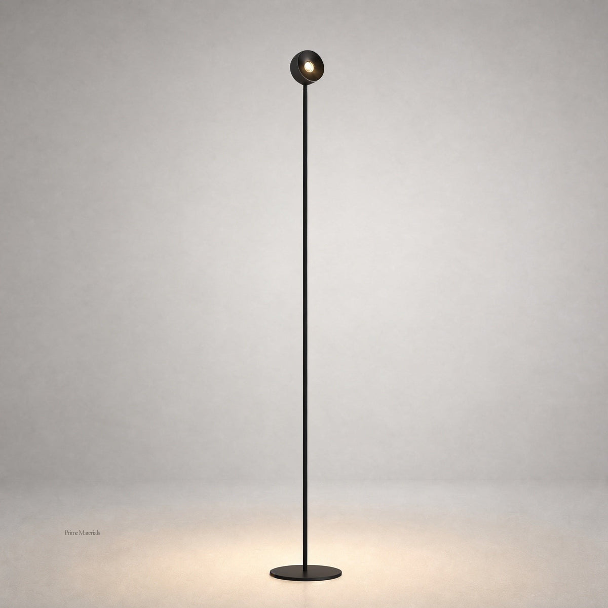 Black matte floor lamp with spherical LED head and warm glow on gray studio background