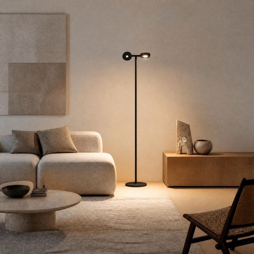 Black matte mobile projection floor lamp with dual adjustable heads casting warm sunset glow in modern living room