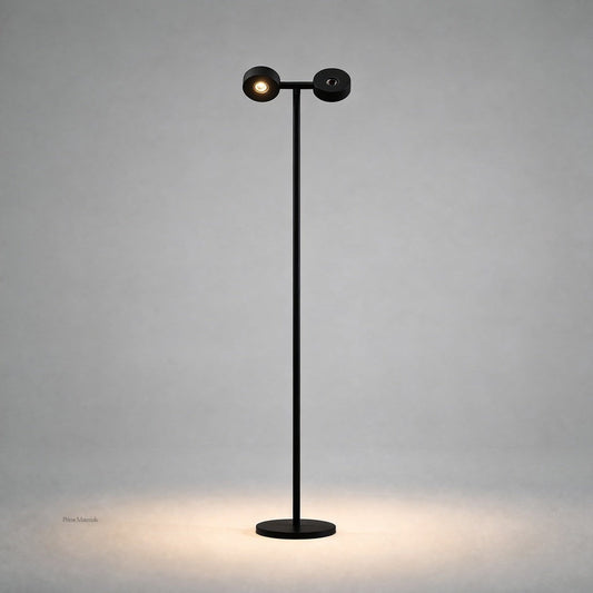Black matte mobile projection floor lamp front view showing dual cylindrical heads and oval warm light footprint