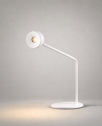 White matte desk lamp with articulated arm and circular head studio shot