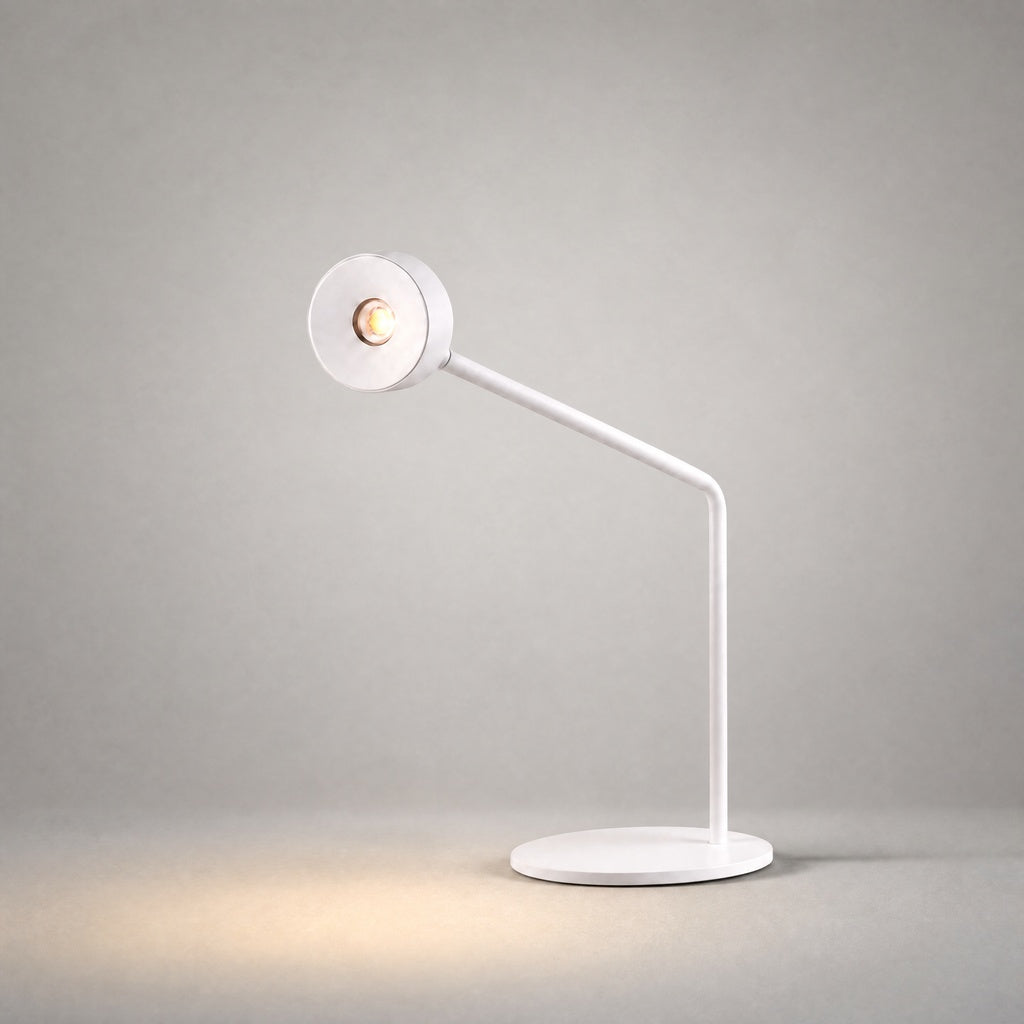 White matte desk lamp with articulated arm and circular head studio shot