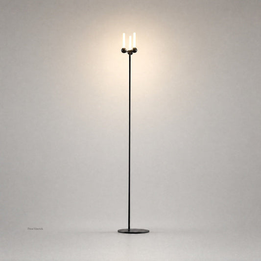 Black Mobile PRIME 0012 floor lamp with spherical joints and warm glow on gray backdrop