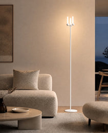 White matte Mobile PRIME 0012 floor lamp with three vertical cylinders beside beige sofa