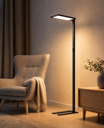 Black matte floor lamp in cozy living room beside beige armchair, warm white light with side control panel