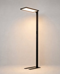 Black matte floor lamp with rectangular LED head and Z-shaped base, minimalist architectural design for interior spaces