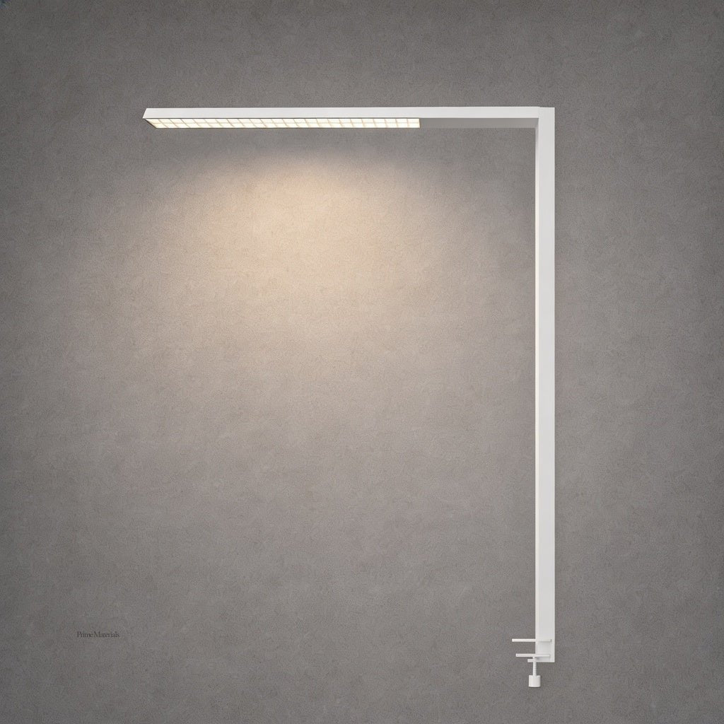 White matte L-shaped desk lamp with adjustable clamp on gray concrete wall
