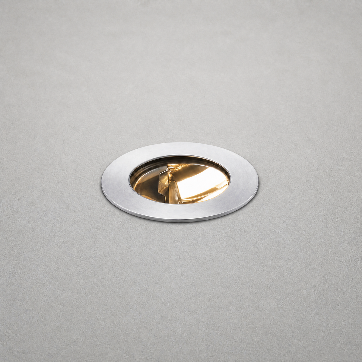 Brushed stainless steel recessed floor light with gold interior reflector detail