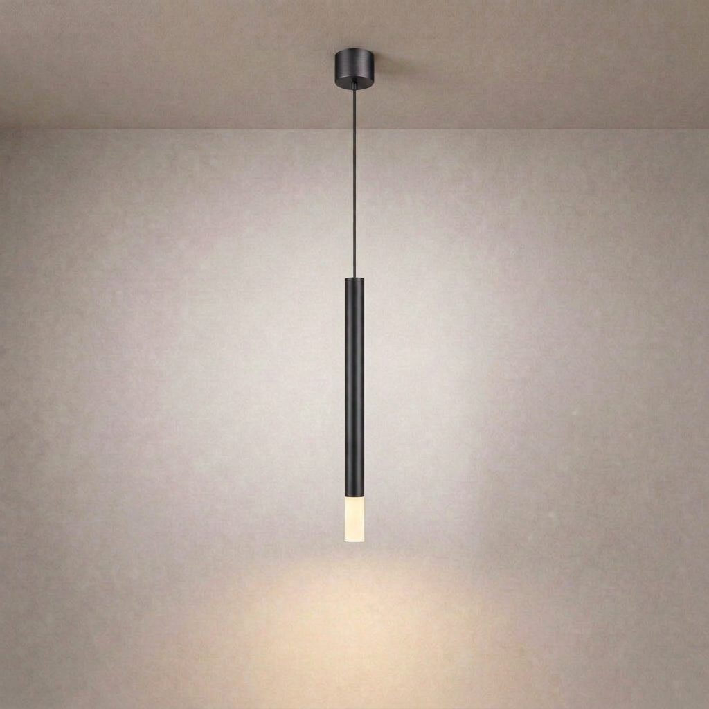 Black vertical linear ceiling suspension luminaire with matte finish casting soft glow on textured beige wall