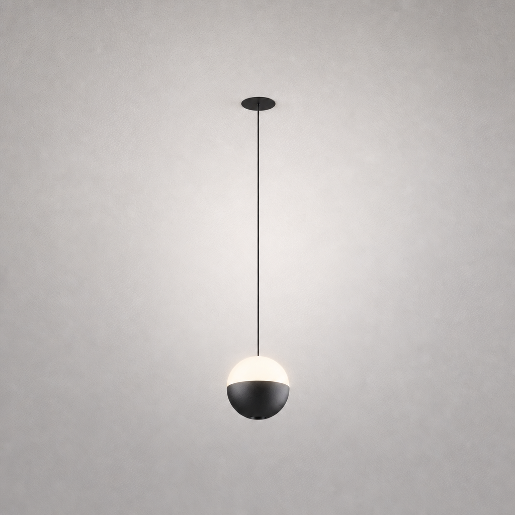 Black ceiling mount and matte black upper sphere pendant light with frosted white lower half