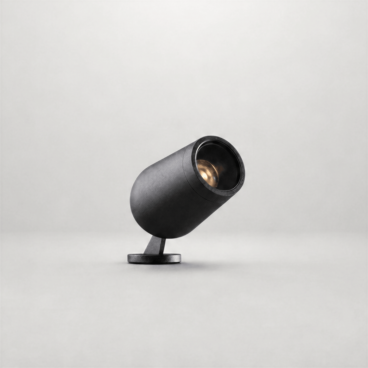 Black industrial finish outdoor spike light with durable grain texture