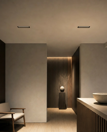 Black framed rectangular recessed LED fixture in contemporary living space