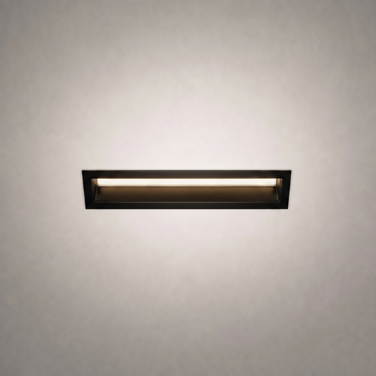 Black frame flush-mount rectangular LED ceiling light emitting warm glow