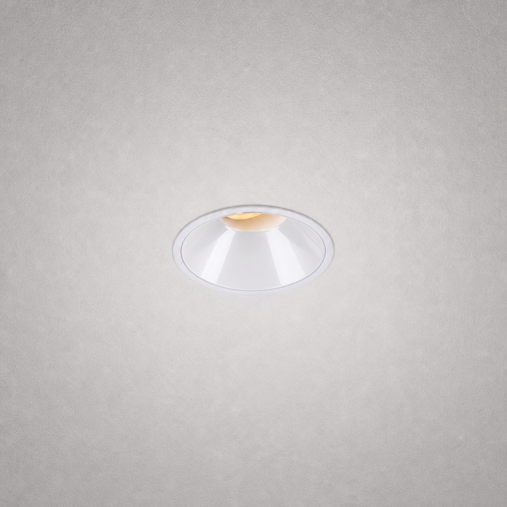 Close-up white matte finish recessed ceiling light with conical reflector
