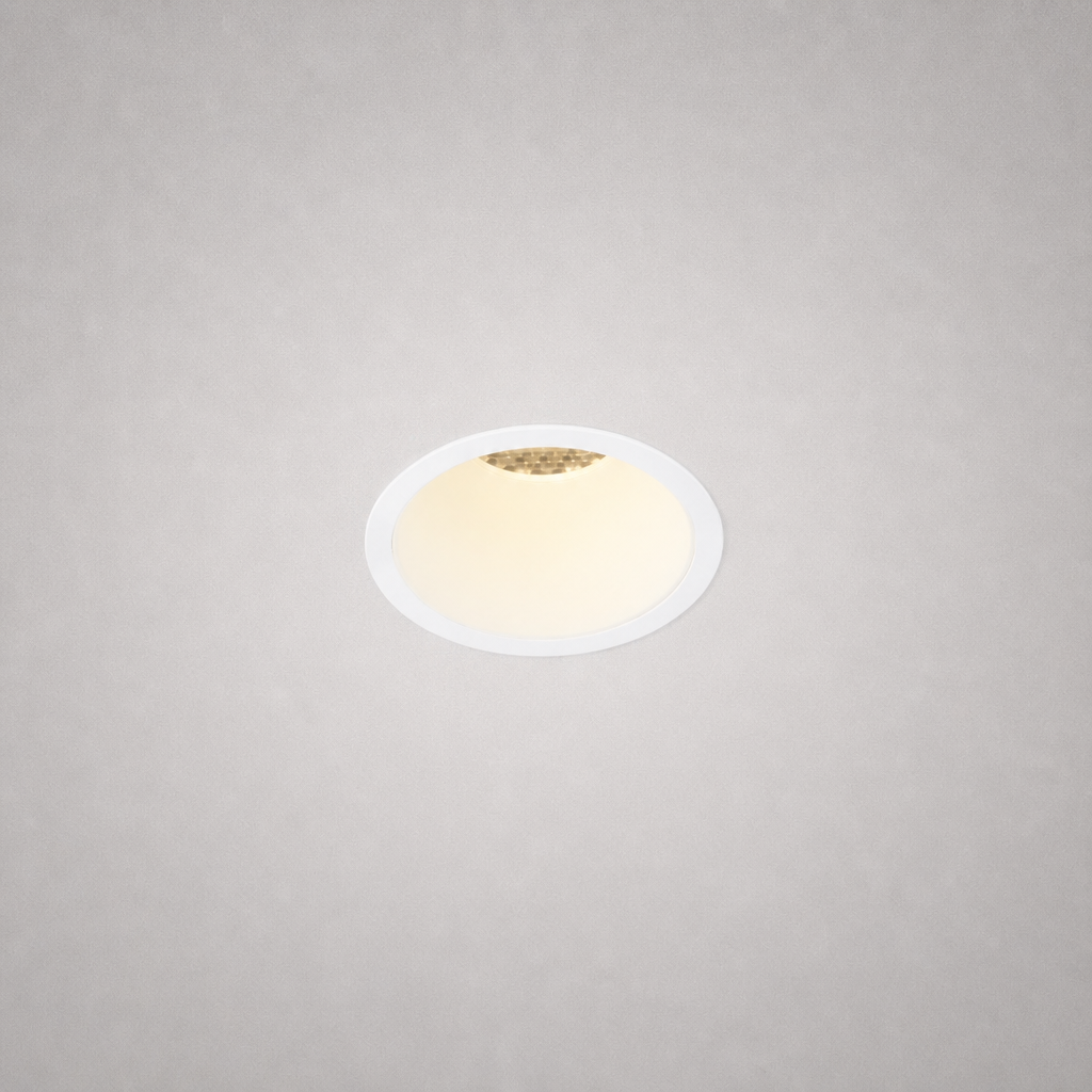 Close-up of MOON PRIME 1820 fixed recessed spotlight with white trim and heat-dissipating fins on matte gray ceiling