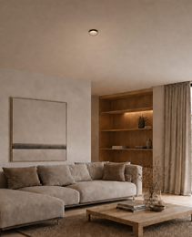 Black semi-recessed ceiling spot light ROYCE PRIME 1828 installed in beige textured ceiling with warm white glow