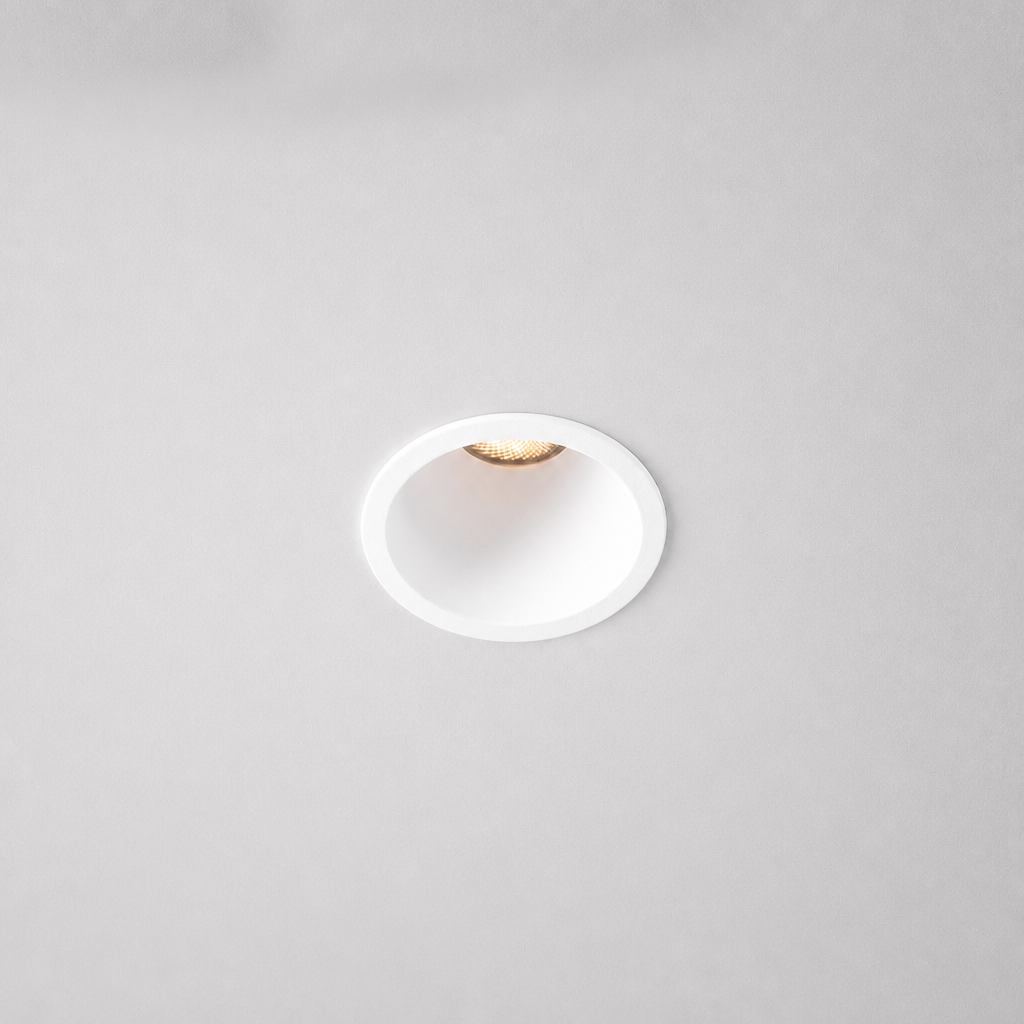 White flush-mount anti-glare recessed LED spotlight with beveled trim