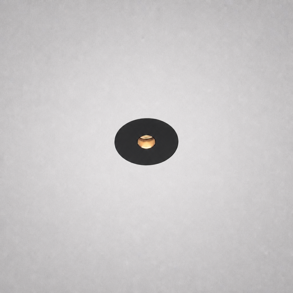 Black Vero Prime 1847 no-border recessed spotlight with gold reflector on textured ceiling