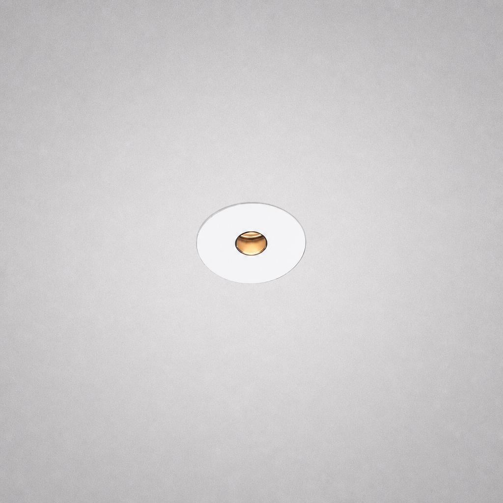 White Vero Prime 1847 borderless recessed light fixture with gold lens on gray ceiling