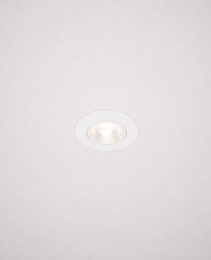 White borderless recessed LED ceiling light emitting bright white glow in minimalist interior
