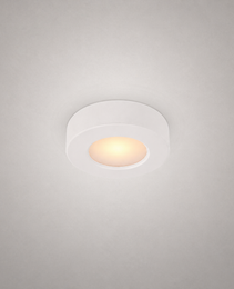 white circular surface-mount recessed luminaire with seamless edge and uniform thickness for modern interiors