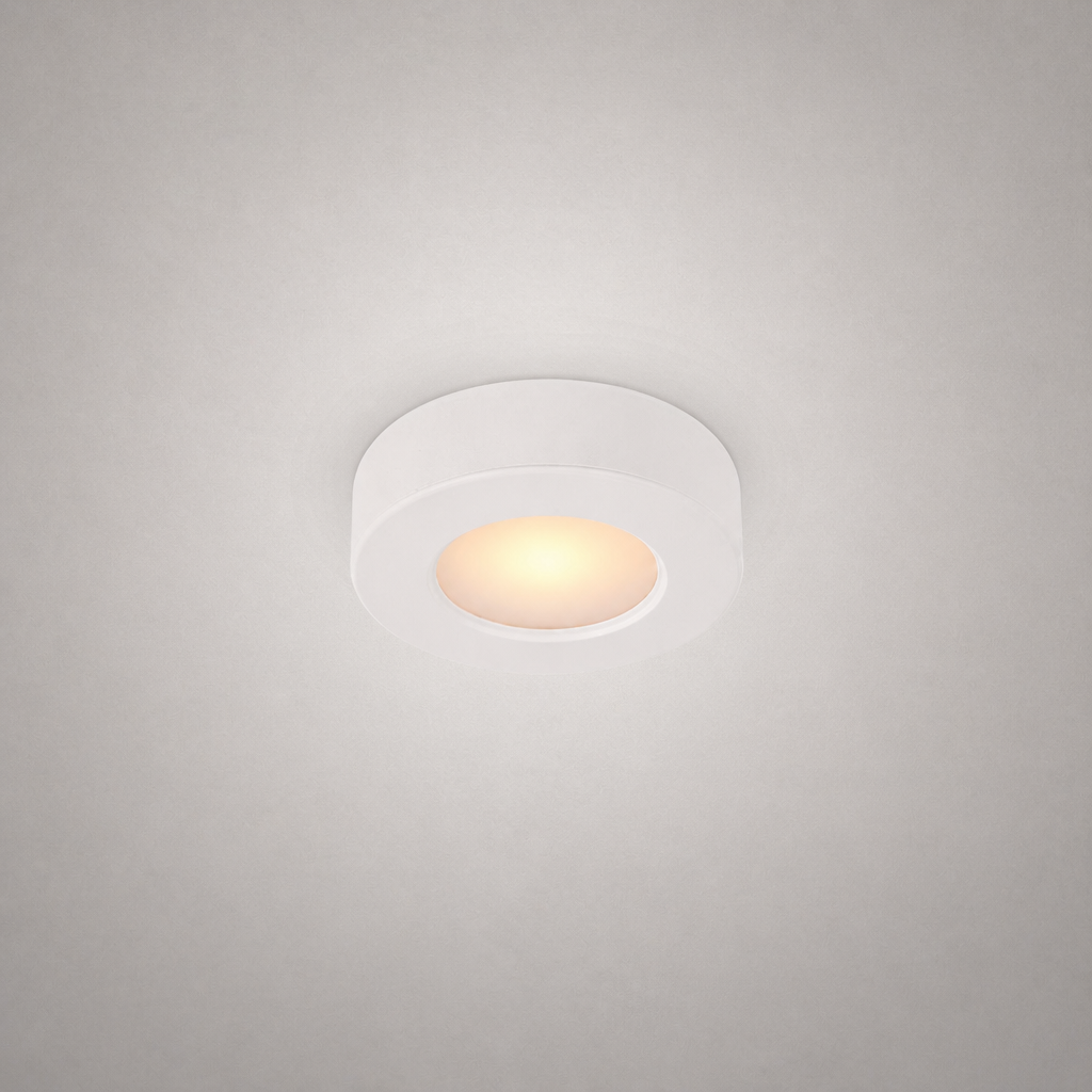 white circular surface-mount recessed luminaire with seamless edge and uniform thickness for modern interiors