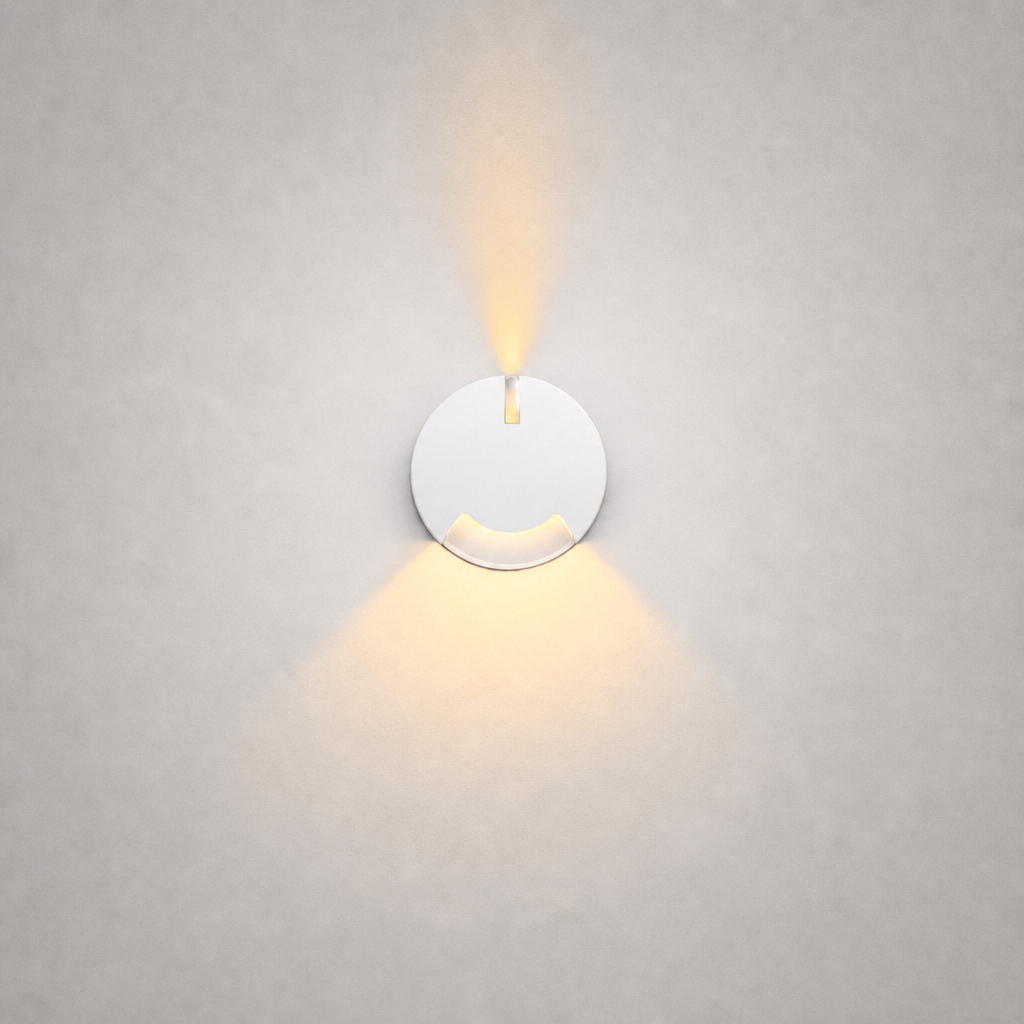 White circular wall fixture with matte finish and dual beam design for clean interior stair illumination
