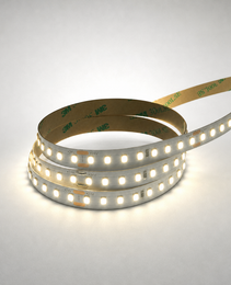 Coiled white 24V CCT adjustable LED strip with visible +24V markings, orange solder pads, and brown 3M 300LSE adhesive backing