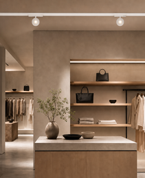 White DC48V rail lighting system with two circular spotlights in modern retail interior