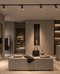 Black matte rail track lighting system with adjustable spotlights in modern retail interior