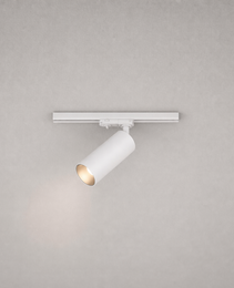 Close-up white cylindrical track spotlight with adjustable head and gold reflector