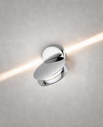 Polished chrome oval wall sconce with reflective finish and crisp diagonal light beam