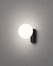 Matte black oval wall light showing soft diffused circular glow pattern