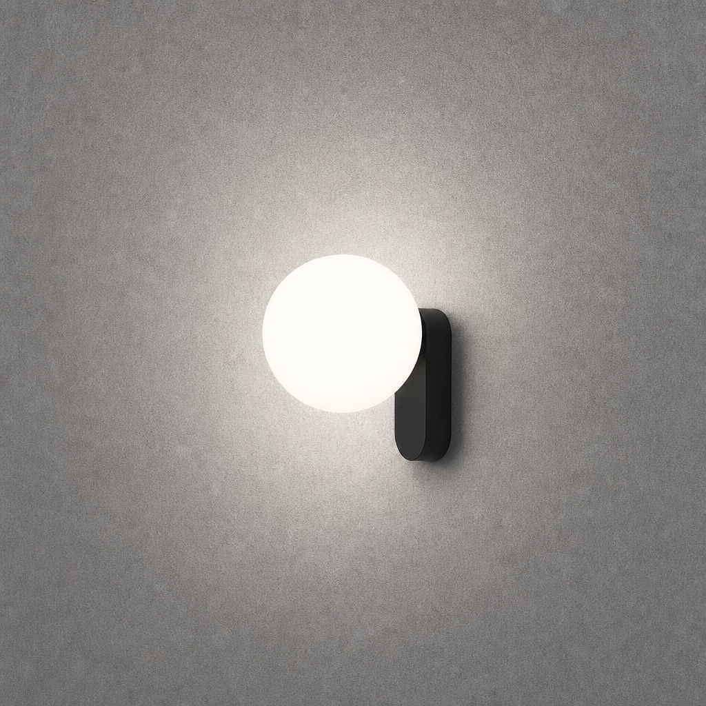 Matte black oval wall light showing soft diffused circular glow pattern