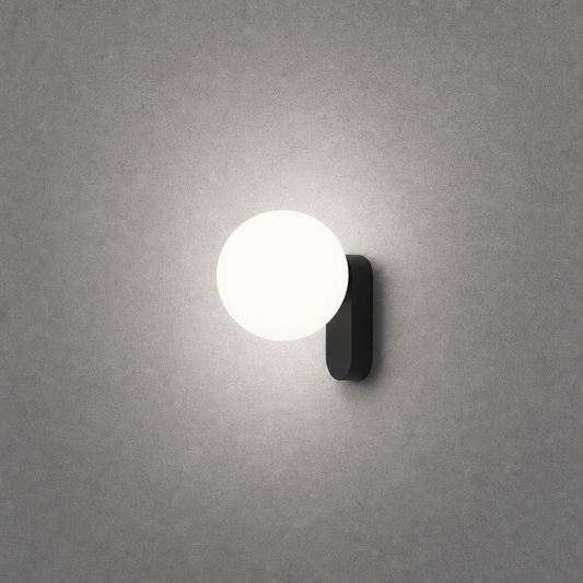 Matte black oval wall light showing soft diffused circular glow pattern