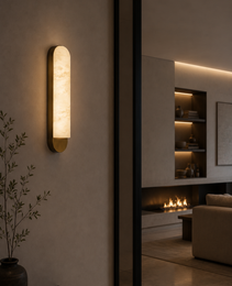 Arcis natural alabaster wall sconce with beige cream veining and matte gold bracket in modern living room