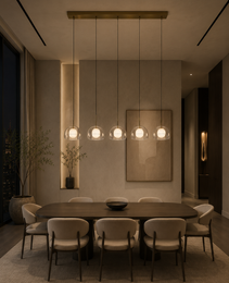 Five Crysta alabaster pendant lights with frosted glass shades and natural stone cores over dark wood dining table