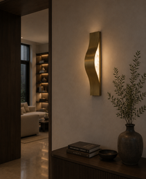 Sculptural Helix bronze and alabaster light fixture showing natural stone veining above console