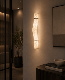 Organic shape alabaster wall light fixture LIBRA with black metal rings in minimalist interior setting