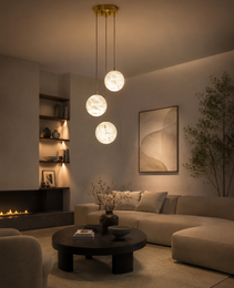 Creamy white marble sphere chandelier with gray marbling and warm ambient glow