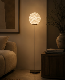 Close-up of Marsa Floor alabaster floor lamp showing natural cream veining texture and warm diffused glow