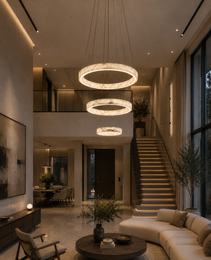 Staggered natural alabaster circular chandelier with warm glow in double-height open space
