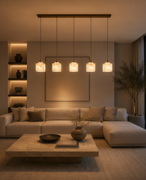 Natural veined alabaster square pendant lights in linear arrangement above beige sectional sofa
