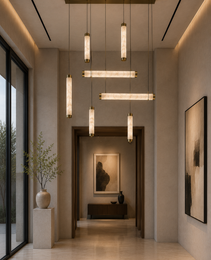Lustre VERSA albâtre pendant light with matte brass canopy, five cylindrical and linear modules in natural veined stone for modern entryway